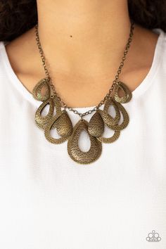 Hammered in an antiqued textured finish, pairs of mismatched brass teardrops gradually increase in size as they drip below the collar, creating a statement-making fringe. Features an adjustable clasp closure. Sold as one individual necklace. Includes one pair of matching earrings. Luxury Brass Teardrop Necklace, Cheap Teardrop Statement Jewelry, Paparazzi Jewelry Images, Pink Jewels, Brass Texture, Fringe Necklace, Brass Necklace, Paparazzi Accessories, Teardrop Necklace