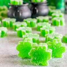 green gummy bears sitting on top of a counter