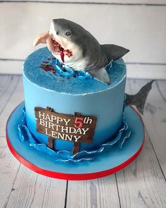 a birthday cake with a shark on top