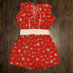 This Romper Is Brand New, It Was Never Worn Red Jumpsuits And Rompers For Spring Beach Outings, Red Jumpsuits And Rompers For Beach In Spring, Vintage Jumpsuits And Rompers For Spring Vacation, Summer Floral Print Red Jumpsuits And Rompers, Red Floral Print Jumpsuits And Rompers For Summer, Red Floral Print Jumpsuit With V-neck, Red Cotton Summer Jumpsuits And Rompers, Red Cotton Beach Jumpsuits And Rompers, Red Summer Jumpsuits And Rompers For Day Out