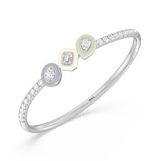 Worn alone or with your other favorites, this ceramic bangle adds an artistic twist. It features a wave of pavé-set round diamonds tracing half of the rigid bracelet's circumference. Three ceramic bezels holding oval, emerald-cut, and pear diamonds add a stylish pop of color. Modern White Diamond Bangle Bracelet, Fine Jewelry White Bangle With Single Cut Diamonds, White Bangle With Single Cut Diamonds, Modern White Diamond Bracelets, Modern White Round Diamond Bracelet, Modern White Diamond Bracelet With Single Cut Diamonds, Modern White Bracelets With Diamond Accents, Silver Lab, Pear Diamond