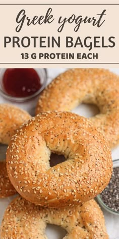 three bagels with sesame seeds and ketchup on the side text overlay reads greek yogurt protein bagels