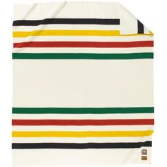 a white blanket with multicolored stripes on the front and back of it,