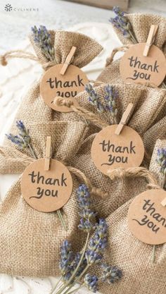 small bags filled with lavender flowers and thank you tags