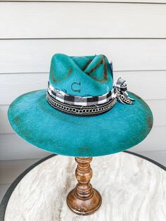 Teal Charlie 1 Horse Hand Decorated Wide Brim Fedora Additional Information: Will need Head Measurement for hat All feathers and ribbons are glued to hold on to the hat. All hats are decorated, burned, hand-burned/engraved by Annrita Velardi Hat was burned, will have a slight odor at first. Please message us if you would like your hat personalized or have any questions. Curved Brim Fedora With Feather Trim For Kentucky Derby, Rodeo Fedora Hat With Feather Trim, Rodeo Fedora With Feather Trim, Brimmed Hats With Feather Trim For Country Events, Fedora With Feather Trim For Rodeo, Feather Trim Fedora For Country Events, Fedora Hats With Feather Trim For Country Events, Country Style Brimmed Hat With Feather Trim, Fedora With Feather Trim For Country Events