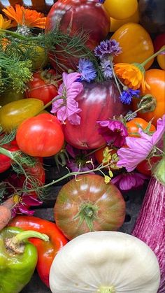 there are many different types of fruits and vegetables together in this photo, including tomatoes, peppers, onions, carrots, and squash