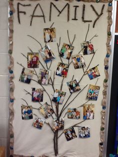 a family tree made out of rocks with pictures on it and the word family written in black