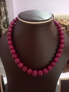 Ruby Necklace Natural Ruby Corundum Smooth Round Beads 513 Carat AAA Ruby Necklace With Adjustable Code Necklace 1.Ruby Corundum 2. Ruby Round Beads 3. 14 inches length, 1 Line String 4. 513 -carat weight 5. 10x10 - 12x12 mm stone size 6, The necklace is with tassel because you can easily adjust your necklace length. 7. If you want any changes in the necklace example if you want with clasp we can do it. Polish :- Handmade Purity :- AAA These natural Ruby gemstones can be used to make different j Ruby Necklaces With Round Faceted Beads, Round Ruby Necklaces With Faceted Beads, Round Ruby Necklace With Faceted Beads, Round Faceted Ruby Beads Jewelry, Ruby Jewelry With Faceted Round Beads, Ruby Jewelry With Faceted Beads, Round Ruby Jewelry With Faceted Beads, Traditional Ruby Necklaces With Round Beads, Polished Beads For Formal Gems And Cabochons