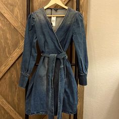 Buffalo Denim/Jean Dress Sz Small Never Worn Pit 15” Length 34” Sleeve 24.5” Waist Is Wrap Around Fitted Medium Wash Denim V-neck Top, Light Wash Knee-length Denim Dress, Knee-length Light Wash Denim Dress, Fall Denim Washed Dress, Fall Washed Denim Dress, Long Sleeve Washed Blue Denim Dress, Light Wash Long Sleeve Denim Dress, Dark Wash Knee-length Denim Dress, Knee-length Dark Wash Denim Dress