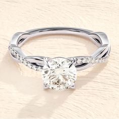 a white gold engagement ring with diamonds on it