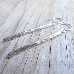 Irresistibly delicate and modern, these lightweight earrings feature 1.5 inches of hammered sterling silver. Sterling silver hook earwires. Rubber earnuts are included. . { o p t i o n s } . In Gold: https://www.etsy.com/listing/164233521/gold-stick-earrings-gold-line-earring In Rose Gold: https://www.etsy.com/listing/170001546/rose-gold-stick-earrings-hammered-earing Smooth:https://www.etsy.com/your/shops/CamileeDesigns/tools/listings/section:10244959/164234055 . { p a c k a g i n g } . Your je Modern Hammered Linear Earrings As Gift, Modern Hammered Linear Earrings For Gift, Minimalist Hammered Sterling Silver Linear Earrings, Minimalist Everyday Linear Earrings With Hammered Detail, Everyday Minimalist Hammered Linear Earrings, Minimalist Hammered Dangle Linear Earrings, Modern Hammered Sterling Silver Linear Earrings, Modern Sterling Silver Linear Earrings With Hammered Detail, Modern Sterling Silver Hammered Linear Earrings