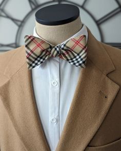 With their classic design and impeccable craftsmanship, these bow ties are sure to turn heads. The plaid pattern adds a timeless charm, making them suitable for both casual and formal settings. Dapper Semi-formal Bow With Ties, Adjustable Brown Bow Tie For Business, Adjustable Pre-tied Bow Tie, Elegant Pre-tied Adjustable Bow Tie, Tartan Bow Tie, Plaid Bow Tie, Custom Bows, Plaid Bow, Handmade Bows