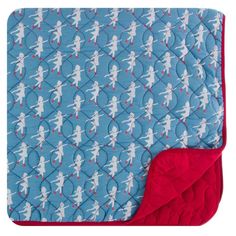 a blue and red blanket with white silhouettes on it