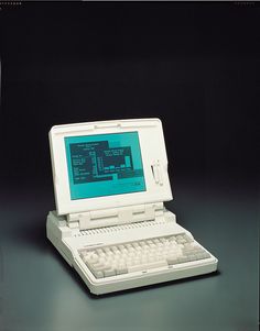 an open laptop computer sitting on top of a table