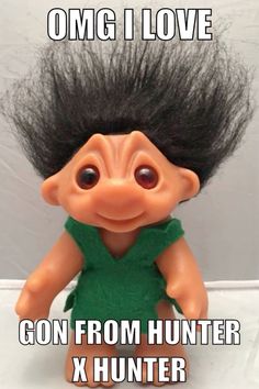 a troll doll with long black hair on it's head and the caption omg i love gon from hunter x hunter