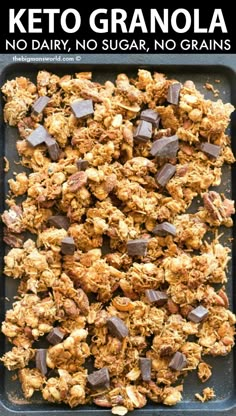 keto granola on a baking sheet with chocolate chunks and text overlay that reads, no dairy, no sugar, no grains