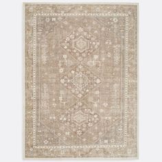 a beige rug with an ornate design on the front and back side, in neutral tones