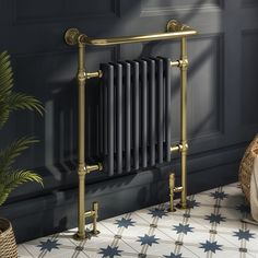 a radiator in the corner of a room next to a potted plant