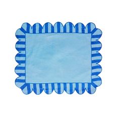 a blue and white place mat with scalloped edges