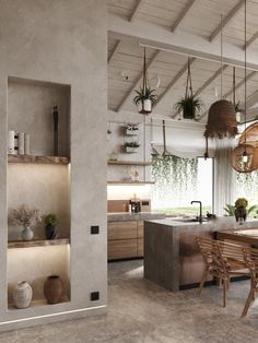 an open kitchen and dining room with plants hanging from the rafters over the counter