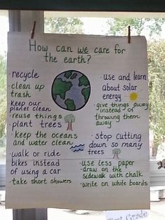 a sign hanging on the side of a building that says how can we care for the earth?