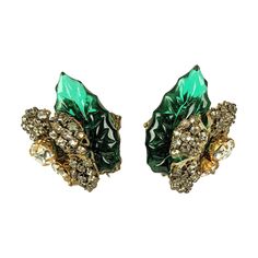 Lovely Miriam Haskell carved french Gripoix glass leaf earrings with clip back fittings. Made with french emerald glass molded and hand cut leaves and half floral gilt filigrees embroidered in rose montee crystals. Green leaves can be worn pointing inward or outward depending on your preference. 1940's USA. Signed. 1" x .75" wide. Matching brooch available. Crystals Green, Filigree Hoop Earrings, Miriam Haskell, Chain Earrings, Leaf Earrings, Blue Beads, Earring Backs, Flower Earrings, Clip On Earrings