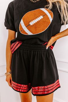 - Add a touch of sporty sparkle to your game day wardrobe with these cute shorts! Sequined jersey-style stripes and subtly distressed hemlines give them trendy energy to keep you looking stylish in the stands. Show your team spirit with our vibrant clothing collection inspired by the bold colors of popular college football teams like the Arkansas Razorbacks, Arkansas State Red Wolves, Texas A&M Aggies, Texas Tech Red Raiders, and the University of Georgia Bulldogs. - Lightweight sweatshirt mater Casual Black Athletic Shorts For Cheerleading, Black Cotton Shorts For Sports Events, Casual Shorts For Cheerleading During Sports Season, Sporty Athletic Shorts For Cheerleading, Sporty Game Day Shorts In Team Colors, Black Athleisure Shorts With Side Stripes, Black Three Stripes Shorts For Sports Events, Casual Black Shorts For Cheerleading, Casual Shorts For Cheerleading