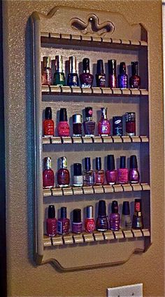 a wall mounted nail polish rack in a bathroom