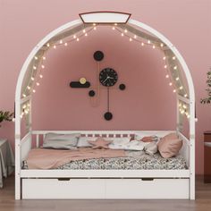 a child's bed with lights on the headboard and foot board in front of a pink wall