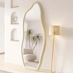 a large mirror sitting on the side of a wall next to a lamp and chair