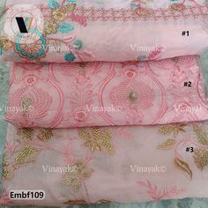 three different types of pink and gold brocades on white fabric, each with an embroidered design