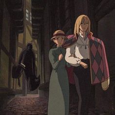 a man and woman standing next to each other in an alleyway with one holding a cat