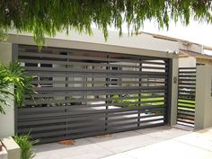 Enclosed Carport, Exterior Garage Door, Door Alternatives, Louvre Doors, Custom Garage Doors, Carport Sheds, Modern Garage Doors, Narrow House Designs, Modern Gate