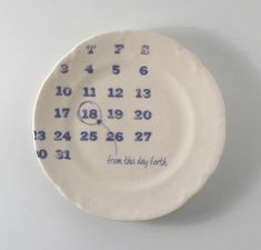 a white plate with blue numbers on it