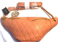 an orange purse with a chain attached to it