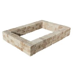 a square brick fire pit sitting on top of a white floor