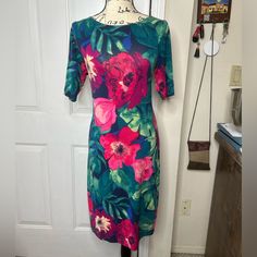 Multicolored Floral Stretchy Bodycon Midi Tommy Bahama Dress. Size: Small But It Stretches To Medium. Short Sleeves. Boat Neckline. Measurements Are Taken Unstretched: Shoulder To Hem 40”, Shoulder To Shoulder 15”, Ptp 16”. Material: 96% Viscose, 4% Spandex. Never Used Fitted Tropical Dress With Vibrant Print, Fitted Tropical Dresses With Vibrant Print, Red Fitted Tropical Dress, Fitted Tropical Print Short Sleeve Dresses, Knee Length Sweater, Tommy Bahama Dress, Amanda Uprichard Dress, Drawstring Dresses, Silk Floral Dress