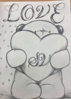 a drawing of a teddy bear holding a heart with the word love written on it