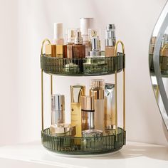 a three tiered shelf with cosmetics and skin care products on it next to a mirror