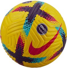 a yellow soccer ball with red, blue and black designs on the outside of it