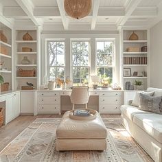 a living room filled with lots of white furniture and bookshelves next to a window