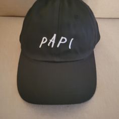 Papi Hat Adjustable Strap Color---Blk/White Like New Condition Never Worn Pre-Owned Trendy Black Dad Hat With Short Brim, Black Dad Hat For Beach, Casual Black Dad Hat For Beach, Casual Black Dad Hat For The Beach, Casual Black Brimmed Dad Hat, Adjustable Brimmed Black Dad Hat, Black Adjustable Brimmed Dad Hat, Black Brimmed Baseball Cap With Letter Print, Adjustable Black Brimmed Dad Hat