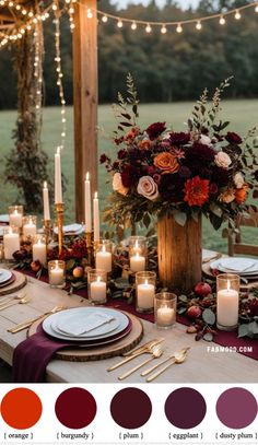 the table is set with candles, plates and napkins for an elegant fall wedding