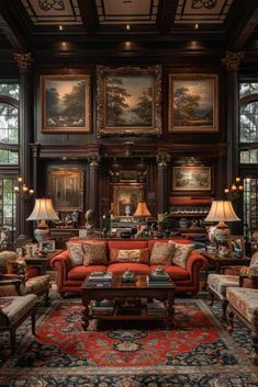 a living room filled with lots of furniture and paintings on the wall above it's windows