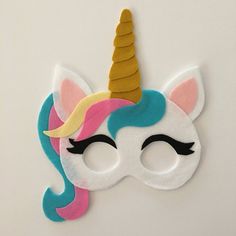 a mask with a unicorn's face painted on it