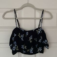 American Eagle Black & Blue Floral Cropped Ruffle Tank Top Size Medium New With Tags/ Never Worn Black With Light Blue, White, Green, And Maroon Floral Pattern Elastic Along Top And Bottom Ruffle Around Top Adjustable Spaghetti Straps See Photos For Approximate Measurements Summer Top, Crop Top, Floral Tank, Floral Top, Floral Print, Floral Pattern, Spring Top, Vacation, Beach, Coastal, Tropical, Beachy, Y2k, Vintage, Boho, Bohemian, Coastal Granddaughter, Coastal Grandma, Coastal Grandmother, T Black Ruffled Crop Top For Spring, Black Ruffled Summer Top, Black Ruffled Crop Top For Summer, Beachy Y2k, Spring Black Ruffled Crop Top, Beach Floral Print Top With Tank Straps, Grandma Coastal, Blue Floral Print Summer Crop Top, Blue Floral Print Tank Top