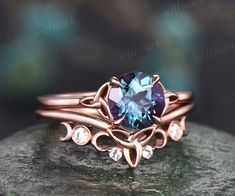 This ring is handmade by myself. The main stone is a 7mm round cut lab alexandrite . The accent stones are moissanites. The material is solid 14k gold(white,yellow,rose gold is also available) Ring size can be choose from the selection box. Matching band available: ?section_id=20674906 This jewelry can also be made in Wedding Ring Sets Vintage, Wedding Ring Sets Unique, Celtic Engagement Rings, Moissanite Ring Set, Celtic Knot Ring, Agate Engagement Ring, Viking Ring, Alexandrite Engagement Ring, Knot Ring