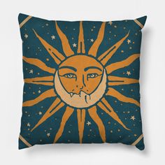 a pillow with an image of the sun and moon on it's face, against a white background