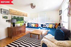 a living room filled with furniture and a checkered rug on top of a hard wood floor