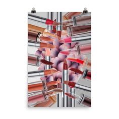 a poster with lipsticks hanging from it's sides and on top of each other